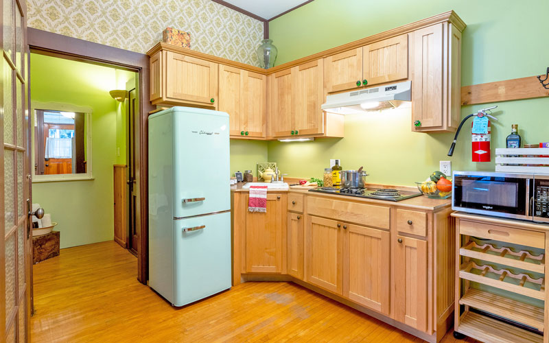 Verandah-Suite-Kitchen-at-Victoria-Falls-House-Nelson-BC Well-equipped kitchenette with a mini-fridge and microwave in the Verandah Suite vacation rental, Nelson BC.