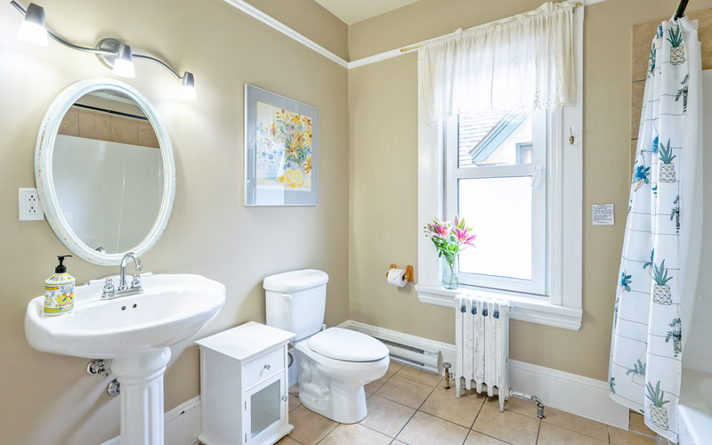 Victoria-Suite-Bathroom-at-Victoria-Falls-House-Nelson-BC Bathroom with a shower and bathtub in the Victoria Suite at Victoria Falls House, Nelson BC.