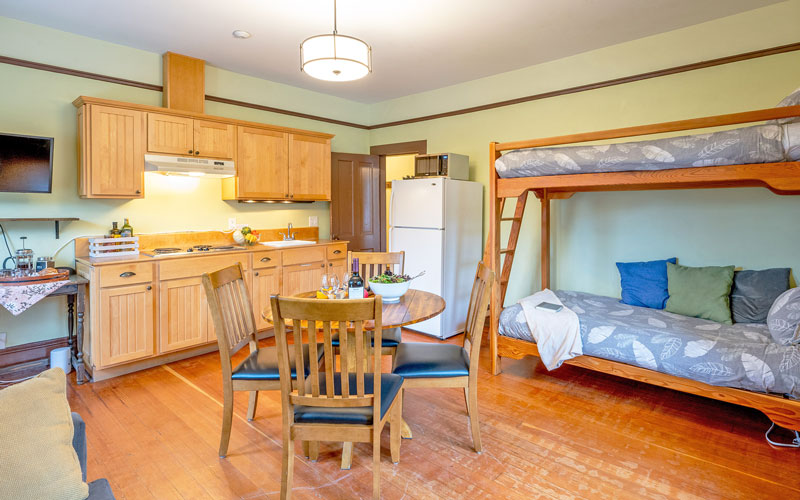 Victoria-Suite-Open-Concept-Area-at-Victoria-Falls-House-Nelson-BC Spacious and airy open-concept living area in the Victoria Suite vacation rental, Nelson BC.